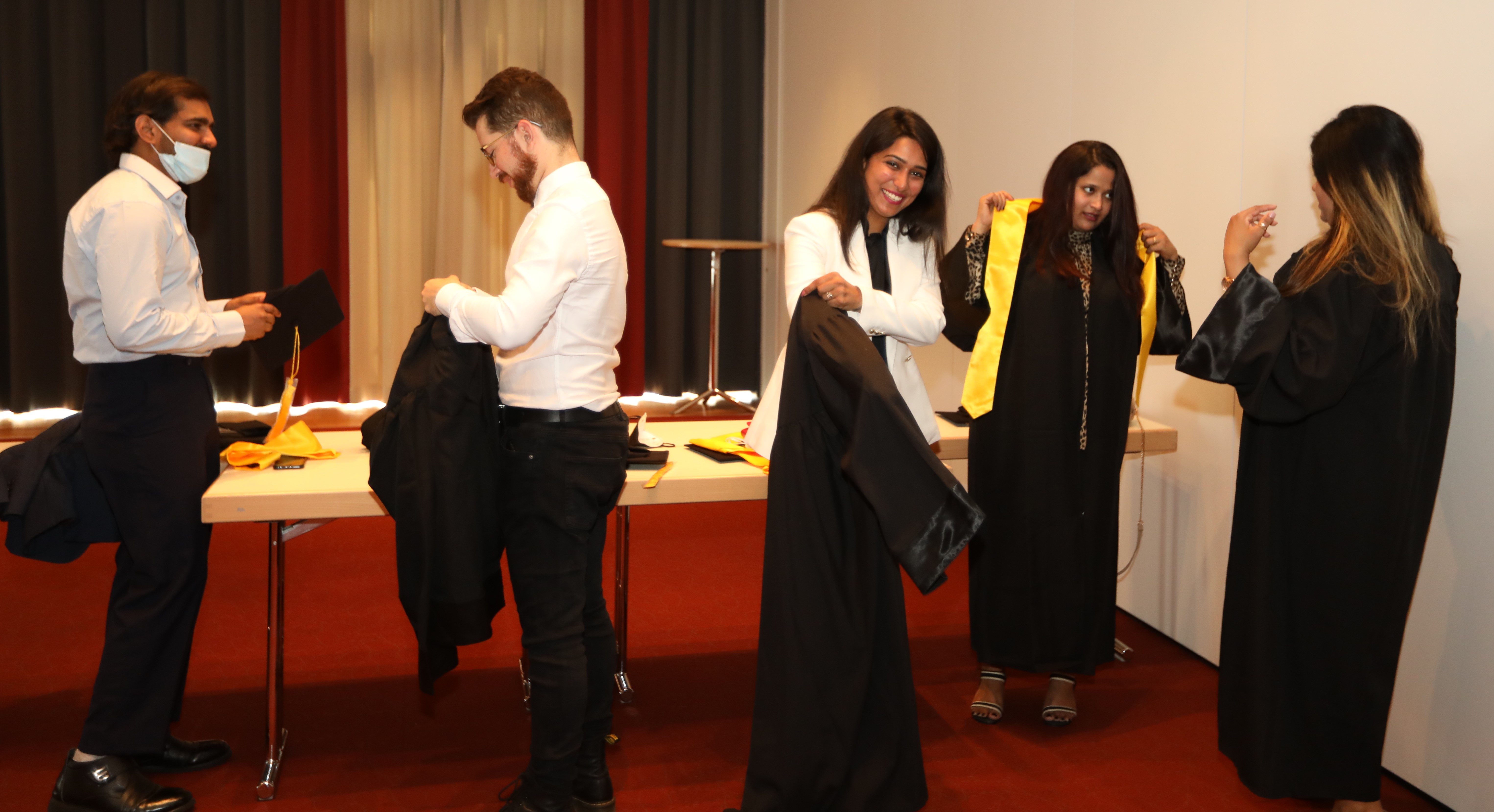Getting ready with graduation gowns!